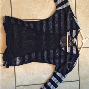 Grey and blue lace shirt with striped sleeves.